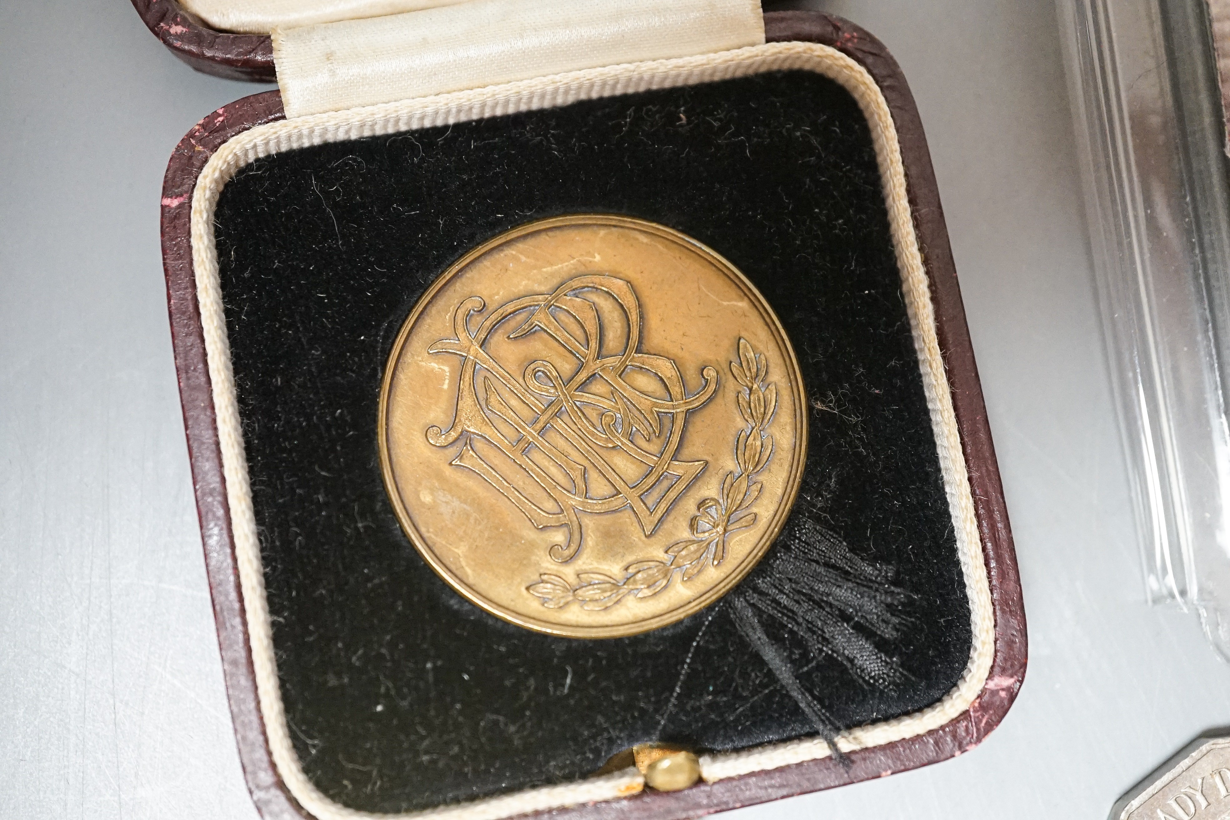 A collection of military badges and a collection of coins